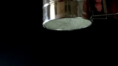 Slow motion shot of sifting flour through sieve Stock Footage 75289495