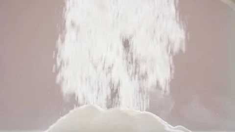 Slow motion shot of sifting flour through sieve. Video stock 88683516