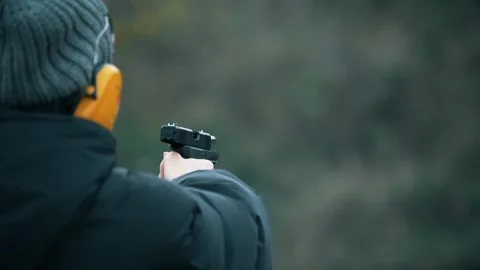 Slow-motion shot of a SIG Sauer P320, a  semi-automatic pistol, being fired. Stock Footage 303762637