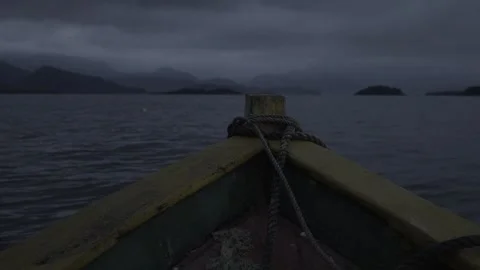 Slow Motion Shot of a Small Boat Moving Across Paraty Bay at Dawn Stock Footage 320634964