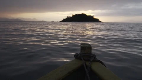 Slow Motion Shot of a Small Boat at Paraty Bay at Dawn Stock Footage 320635033