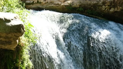 Slow-motion shot of a small waterfall Stock Footage 200705495