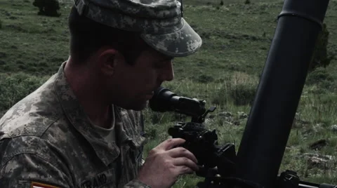 Slow motion shot of soldier setting up mortar launcher and instructor Stock Footage 52257407