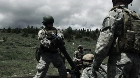 Slow motion shot of soldiers loading and firing mortar launcher at training. Stock Footage 52257483