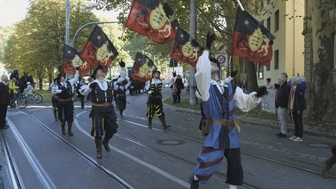 Slow motion shot of soliders, waving their flags, while marching at a Video stock 97649804