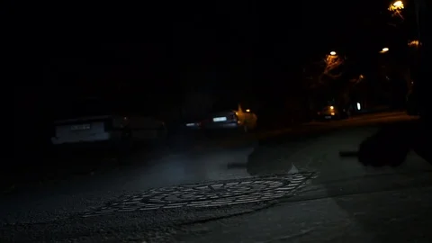 Slow motion shot of steam coming from a manhole in a street. Stock Footage