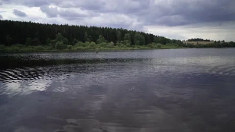 Slow motion shot of stone falling in water Stock Footage 135386010