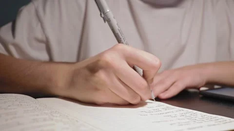 Slow motion shot of student study homework write in daily jounal with black pen Stock Footage 163252025