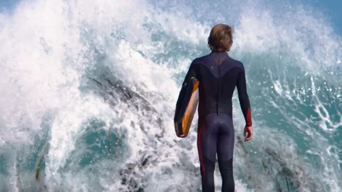 Slow motion shot of Surfer facing a spectacular wave. Stock Footage 87254320