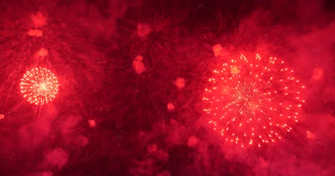 Slow motion shot, three red fireworks explode one by one Stock Footage 326377122