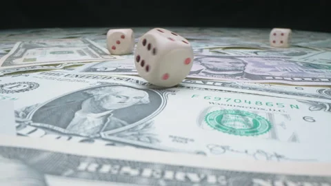 Slow motion shot of throwing dice on US dollar banknotes Stock Footage 141963954