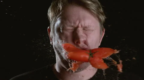 Slow motion shot of tomato hitting man in face, shot on Phantom Flex at 2000 fps Stock Footage 55666837