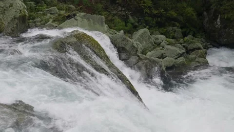 Slow motion shot of top of waterfall Stock Footage 327764696