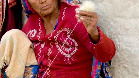 Slow motion shot of traditional Pakistani woolen thread making (2) Stock Footage 252124132