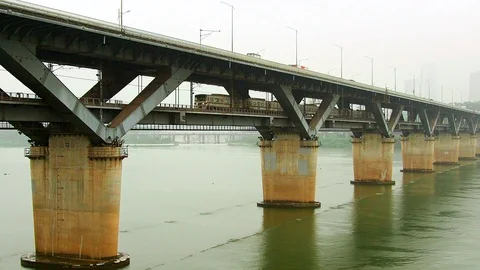 Slow motion shot of train moving through Cheongdam Bridge across Han River Stock-Footage 123261167