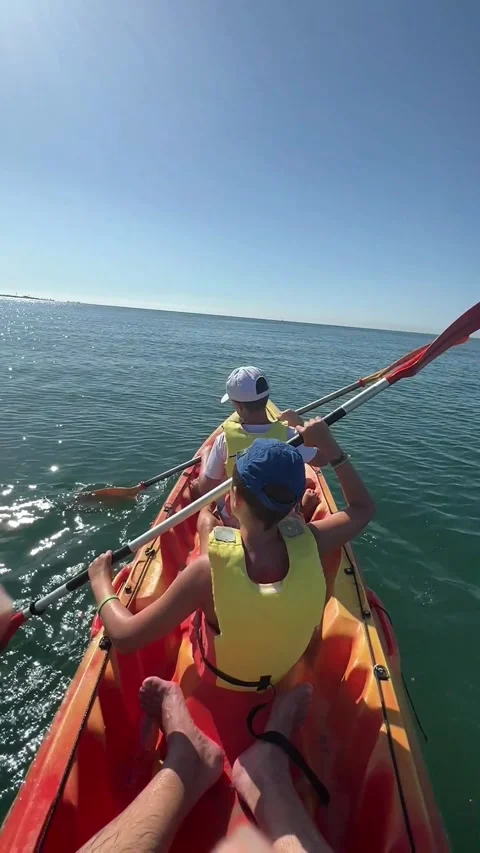 Slow motion shot of two children sailing in a kajak. Stock Footage 242445322