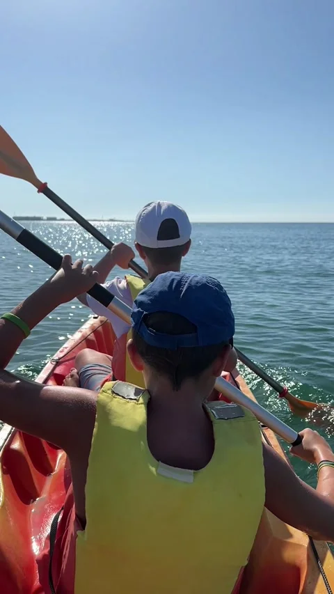 Slow motion shot of two children sailing in a kajak. Stock Footage 242445353