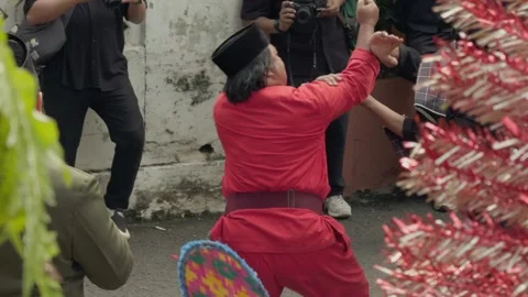 Slow-motion shot of two men performing Maen Pukul martial art from Betawi.  Stock Footage 314630900