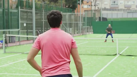 Slow motion shot of two young males playing tennis Stock Footage 172325749