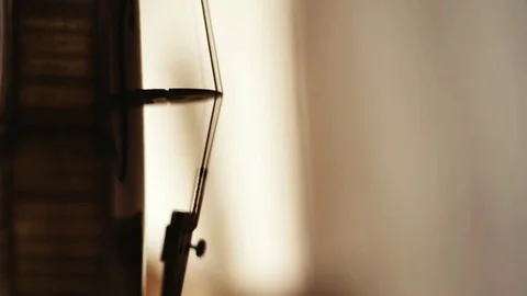 Slow motion shot of a violin silhouette in a luthier workshop Stock Footage