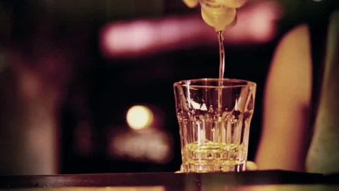 Slow motion shot of Vodka pouring at the bar - close up  Stock Footage 72277245