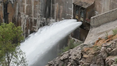 Slow motion shot of water being jet out of dam from enormous pipes. Cordoba 库存影片 118996953