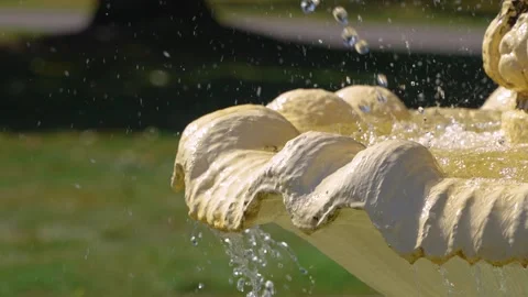 Slow motion shot of water droplets splashing in a fountain Stock Footage 320448520