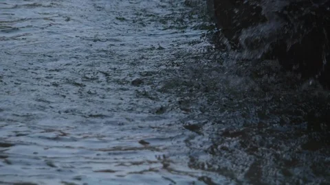 Slow motion shot of water drops falling from a fountain Stock Footage 88867712