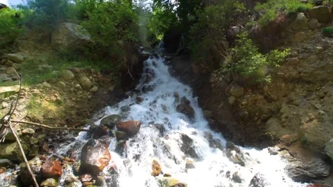 Slow motion shot of water fall splashes in hilly area of Pakistan. (6) Stock Footage 200756009
