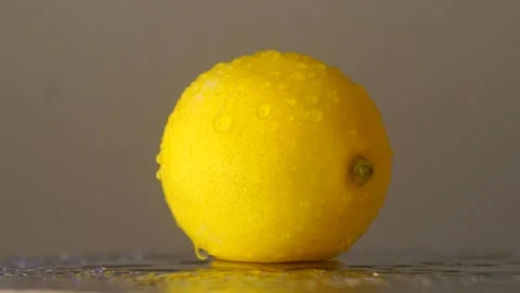 Slow Motion Shot Of Water Falling On Fresh Lemon At 100 Fps Stock Footage 144681994