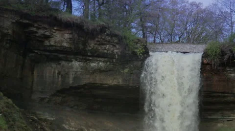 Slow-Motion shot of water tumbling down the top of Minnehaha Falls Stock Footage