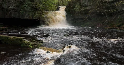 Slow motion shot of a waterfall in full spate Video stock 237693141
