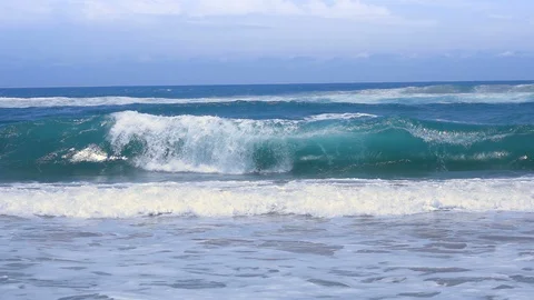 Slow motion shot of wave curling over itself and crashing Stock Footage 87703182