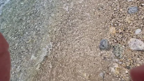 Slow motion shot of waves on Adriatic sea beach, beautiful view of bay with.. Video stock 244489016