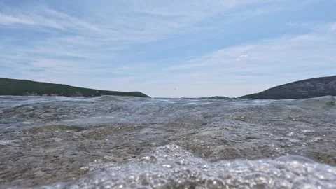 Slow motion shot of waves on Adriatic sea beach, beautiful view of bay with.. 스톡 동영상 244489180