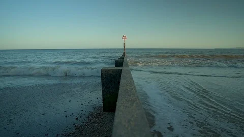 Slow motion shot of the waves on Bournemouth Beach Stock Footage 92063754