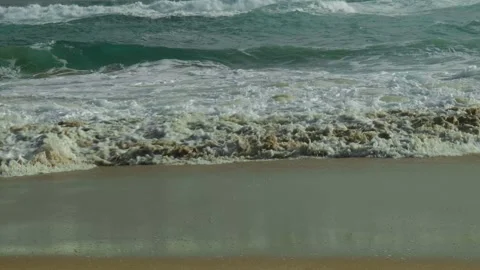 Slow Motion Shot of Waves Breaking on Sandy Bank Stock Footage 303021087