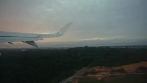 Slow motion shot from the windows of an airplane starting a fly Stock Footage 137676713