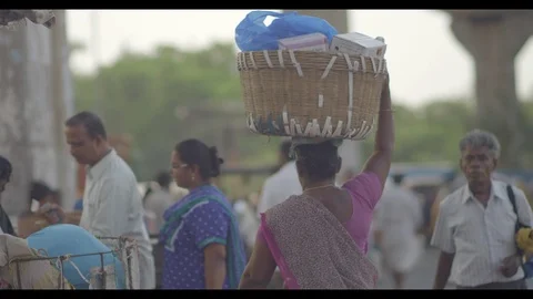 Slow motion shot of woman walking in India Stock Footage