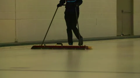 Slow Motion Shot Of Worker Cleaning Sheet With Mop In Curling Stadium - Los Stock Footage 237031039
