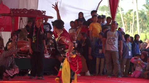 Slow motion shot of young man doing a dance with a costume Stock Footage 251513694