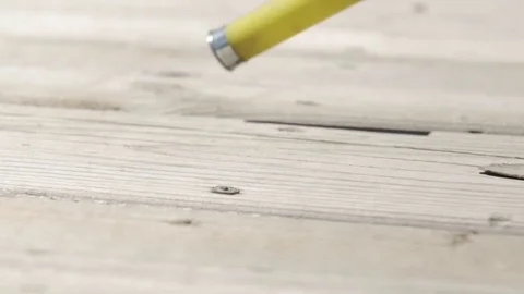 Slow motion shotgun shell hits ground and rolls toward camera 库存影片 79470084