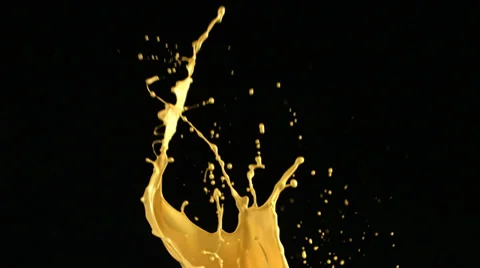 Slow motion shots of yellow paint splattering Stock Footage