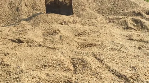 Slow motion shovel falling down on the sand Stock Footage 65632463