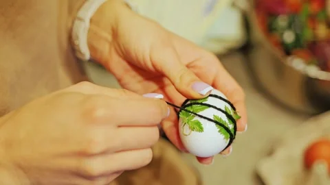 Slow Motion Shows Hands Wrapping Herbs Around Egg For Natural Easter Dyeing Stock Footage 344008036