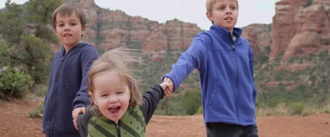 Slow Motion Siblings Having Fun on a Scenic Hike Stock Footage 61719079
