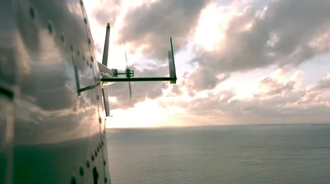Slow motion of side of helicopter over water Stock Footage 61741085