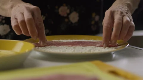 Slow Motion Side Shot Of Meat Falling On A Plate Full Of Flour Stock Footage 263965527