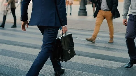Slow motion side shot of walking businessman with suitcase Stock Footage 104264058