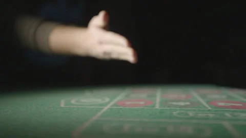 Slow motion side tracking shot red dices on table Vídeos de archivo 335699926